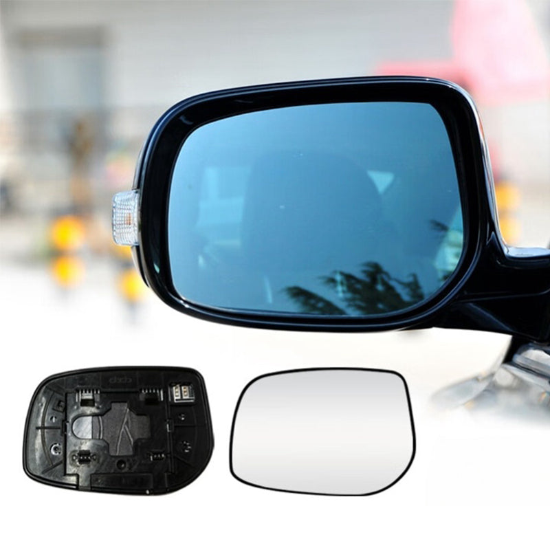 Car side mirror with additional mirror glass and backing plate on a blurred background