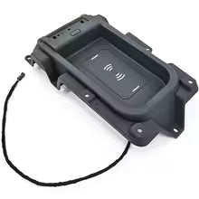 Car audio control panel with buttons and a cable on a white background