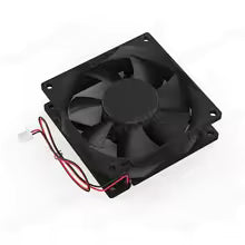 Black cooling fan with red and white wires on a white background